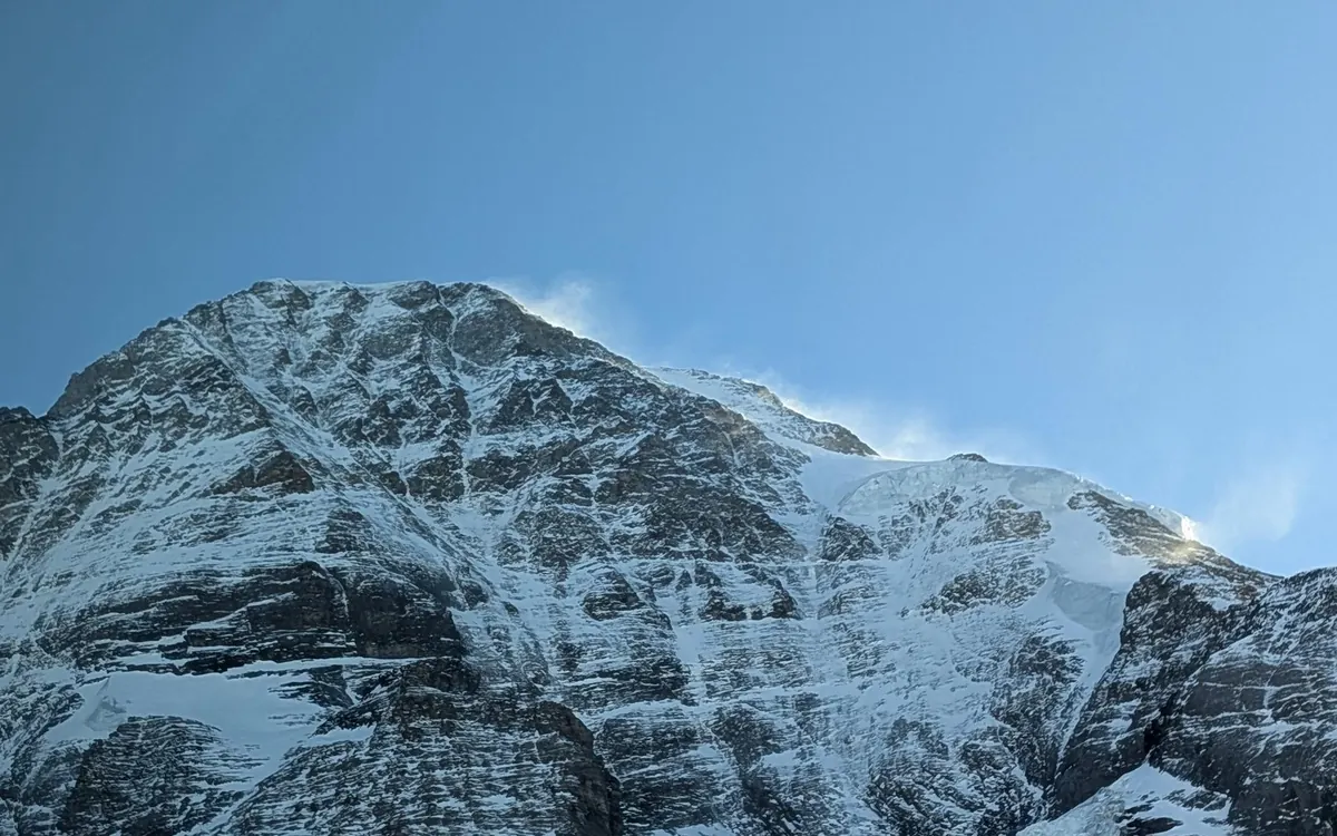 The cogwheel train climbing towards Jungfraujoch above the valley near Interlaken